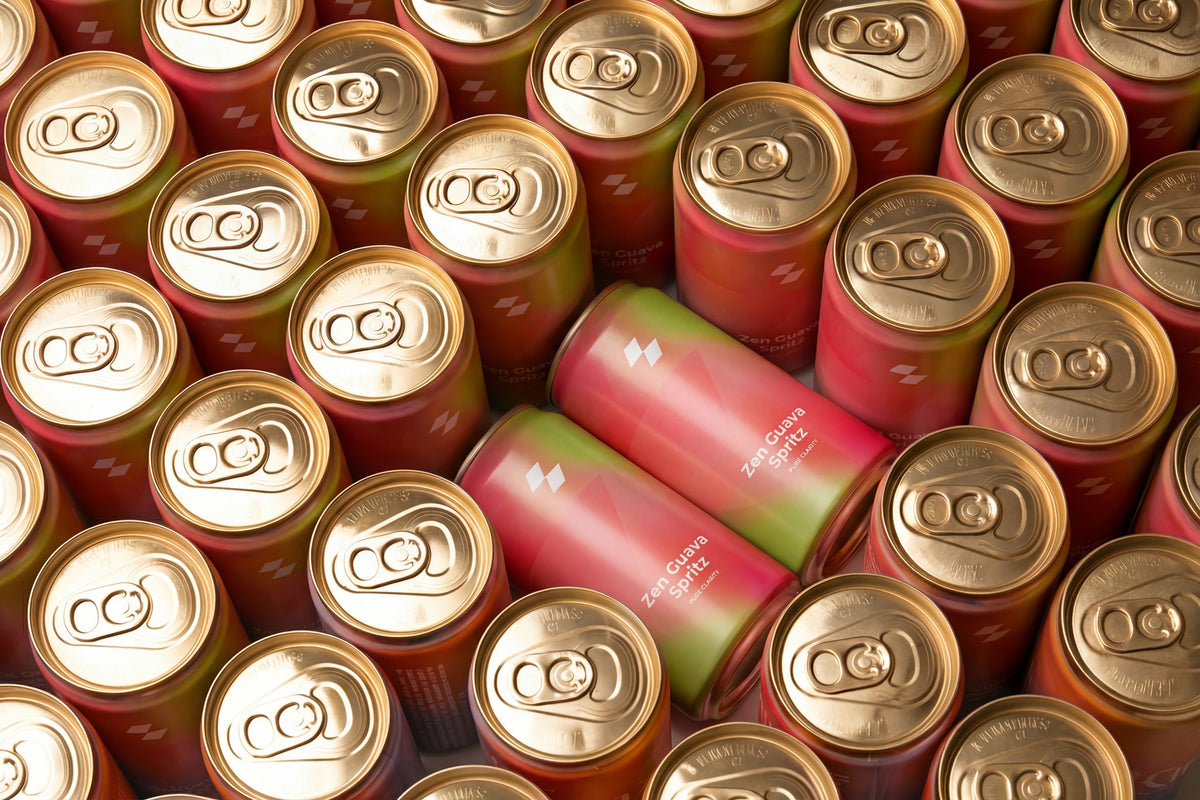 Collection of beer cans with gold and red labels.