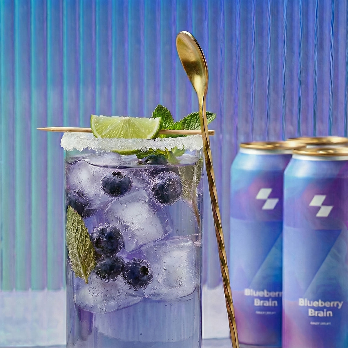 Glass of iced drink with blueberries, lime, and mint, accompanied by three cans labeled 'Blueberry Brain' on a gradient background.