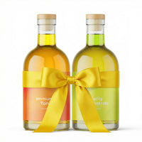 Two bottles of 'Immunity Tonic' and 'Vitality Concentrate' with yellow ribbons on a white background (2-Bottle Set)