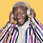 Person wearing headphones and striped shirt with colorful background