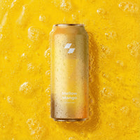 Can of 'Mellow Mango' on a yellow background with bubbles