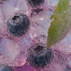 Fresh blueberries with ice and sparkling bubbles closeup
