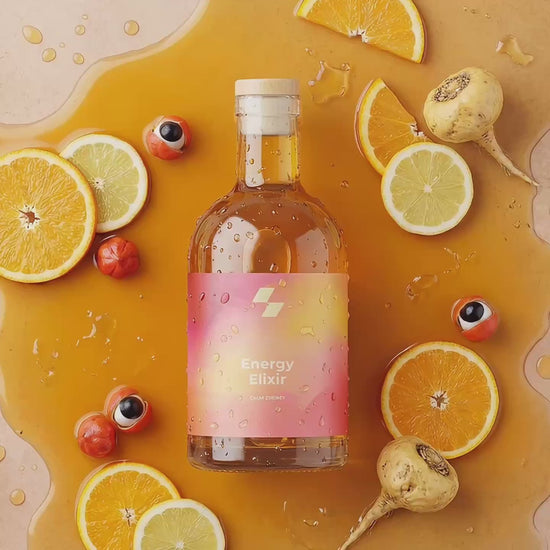 Energy Elixir wellness bottle with citrus fruits and guarana seeds